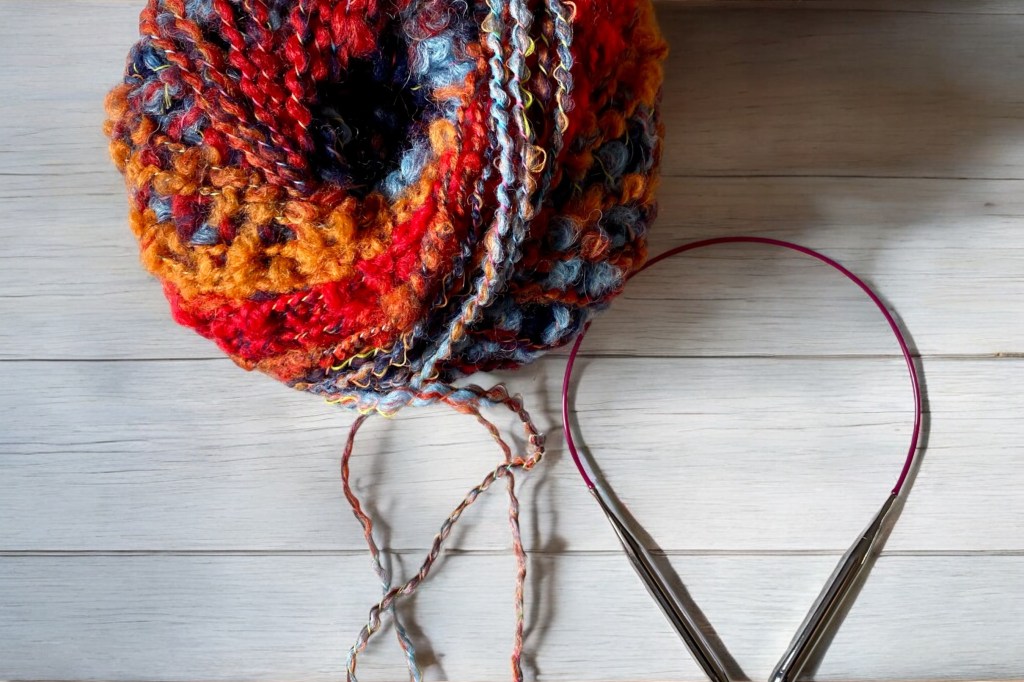 Katia Funk yarn and circular knitting needles to make the hat.