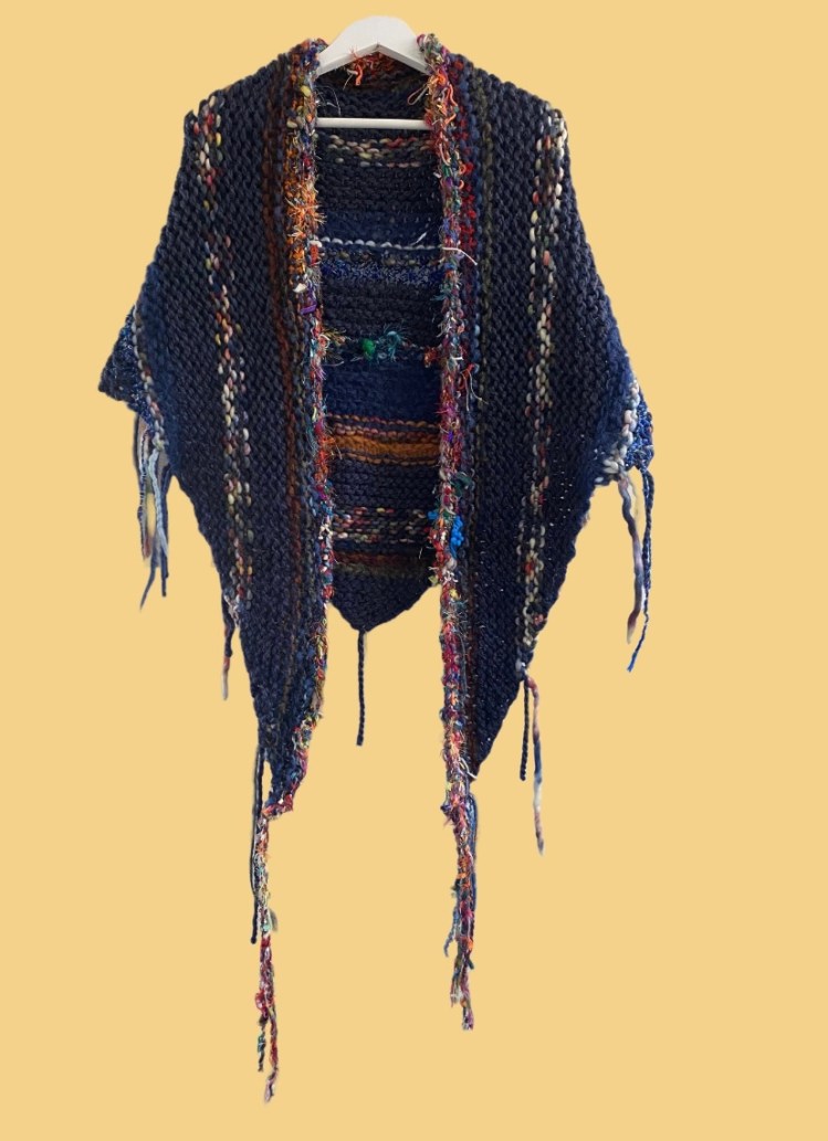 a knitted super chunky boho shawl made with super chunky yarn