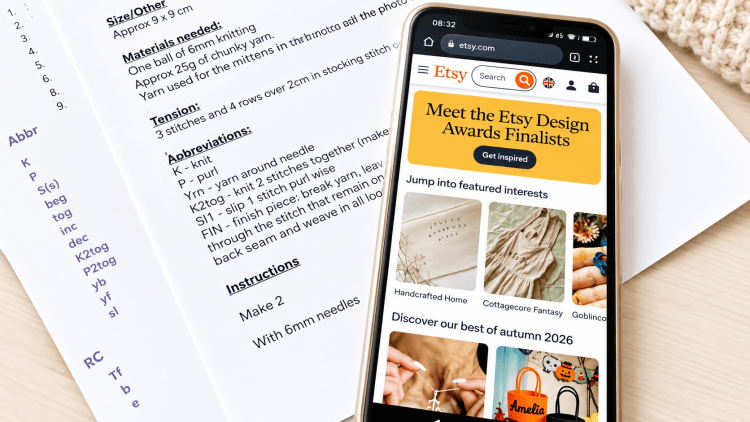 a mobile phone and instant download knitting pattern PDF files printed out on paper